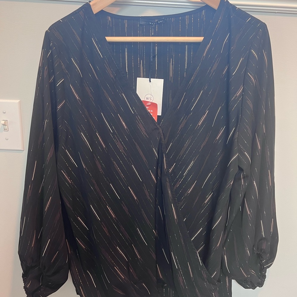 Black blouse with gold and white accents